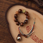 Tibet Jujube Wood Yin Yang Bracelet – wooden bead bracelet with yin-yang gourd pendant and multicolor tassel on carved tra...