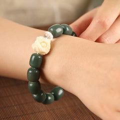 Bodhi Seed Lion Head Om Mani Padme Hum Bracelet - worn on wrist with floral carved bead, spiritual jewelry
