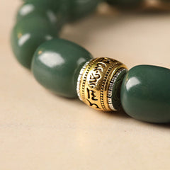 Bodhi Seed Lion Head Om Mani Padme Hum Bracelet - gold mantra bead close-up, tibetan prayer bracelet