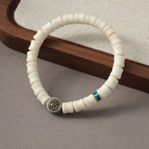 Bodhi Seed Dragon Pattern Bracelet – three-quarter view with bone beads turquoise and medallion, Protection