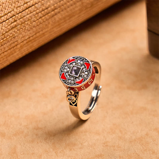 Copper Prayer Wheel Ring - Side angle showing red enamel medallion with dark bezel stone, rotatable prayer ring