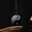 Black Obsidian Yin Yang Necklace – On dark weathered wood, obsidian protection necklace