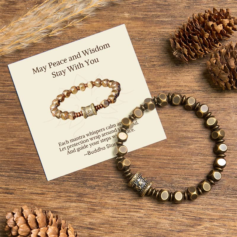Brass Om Mani Padme Hum Bracelet – prayer wheel bead bracelet with gift card on rustic wood, spiritual healing jewelry