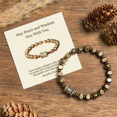 Brass Om Mani Padme Hum Bracelet – prayer wheel bead bracelet with gift card on rustic wood, spiritual healing jewelry
