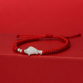 999 Silver Koi Fish Red String Bracelet – red braided cord with silver fish charm and spacer beads on red stepped platform
