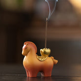 Year of Horse Ingot Incense Burner – Terracotta horse figurine with gold saddle and apple holder, rising smoke, incense burner