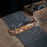 Boat Cicada Ceramic Incense Burner – Fishing boat with fisherman and backflow smoke on woven mat, zen decor