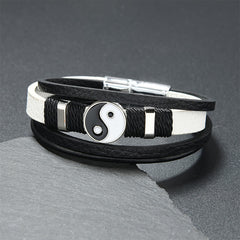 Yin Yang Leather Balance Bracelet – black and white dual-leather strap with silver yin-yang medallion on slate, unisex bra...