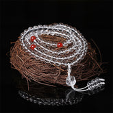 Liuli Lotus 108 Bead Mala - coiled on twig nest with red marker beads, clear crystal meditation necklace