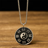 Yin Yang Bagua Pendant - Front view showing silver Taijitu and Eight Trigrams on black enamel, yin yang necklace