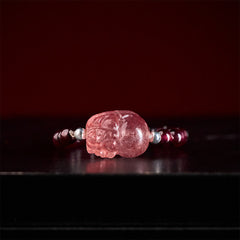 3mm PiXiu Gemstone Ring – Front view of PiXiu with pearl accents and garnet beads, red background
