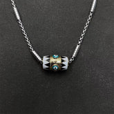 Evil Eye Pendant Necklace – Cylindrical evil eye bead with turquoise eyes on braided silver chain