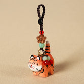 Wood Tiger Keychain – orange striped tiger with red and green beaded cord, carved wood charm