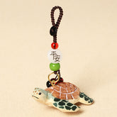 Wood Turtle Keychain – Hand-painted turtle with green flippers, brown shell, and peace blessing bead strand, wooden keychain