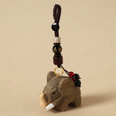 Wood Elephant Peace Keychain - Hand-carved elephant pendant with obsidian and mantra beads on braided cord, wooden charm