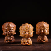 Chinese Zodiac Green Sandalwood Buddha – three carved wooden Buddha busts on dark wood, Handcrafted