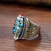 Dzi Bead Prayer Wheel Ring – silver band with blue nine-eye pattern and gold carving on wood