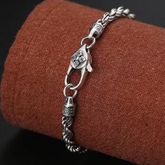 Silver Vajra Bracelet – engraved lobster clasp with cross emblem on fabric stand, Tibetan bracelet