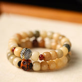 Natural Bodhi Seed Om Mani Padme Hum Wisdom Bracelet - Earthy beads with lotus and dzi charm