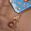 Tibetan Zakiram Thangka Amulet Keychain, front view, lucky charm