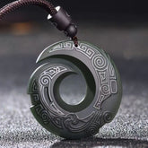 Hetian Cyan Jade Peace Buckle Luck Necklace – Dark green carved jade pendant with spiral cutout design, traditional cloud motifs, and black braided cord on dark background