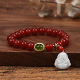 Red Agate Buddha Bracelet - Full view on wood with white Buddha charm, green gem accent
