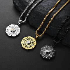 Bagua Yin Yang Titanium Steel Pendant - Three color variants silver gold black on dark stone, bagua pendant