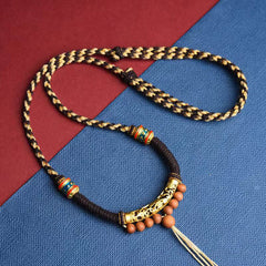 Tibetan King Kong Knot Prayer Wheel Necklace – close-up of gold filigree tube with enamel beads, prayer pendant
