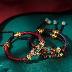 Tibetan Turquoise Om Mani Padme Hum Braided Bracelet – Burgundy and navy cord variants with gold metalwork, dzi bead style
