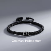 Om Mani Padme Hum Braided Peace Bracelet – flat lay with engraved silver charm, silver braid bracelet