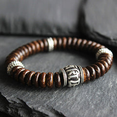 Om Mani Padme Hum Coconut Shell Bracelet – low-angle close-up on slate, men's bead bracelet