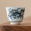 Blue & White Dragon Ceramic Teacup – single cup on walnut wood, cobalt blue dragon detail, handcrafted