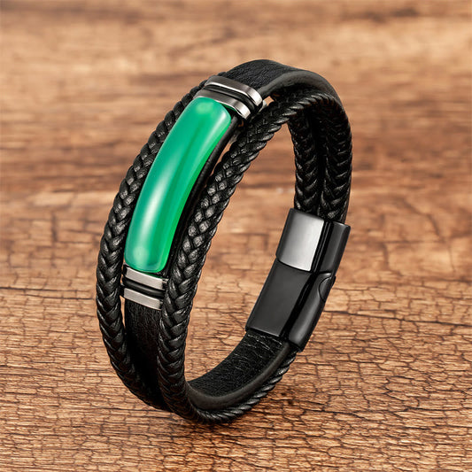 Green Agate & Tiger Eye multilayered leather bracelet with green agate stone center, braided black leather cords, and magnetic clasp on rustic wood background.