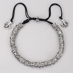 Tibetan Mantra Purity Bracelet – Top-down silver prayer beads on black cord with end charms, Buddhist bracelet