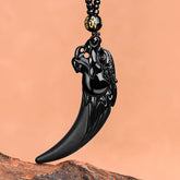 Black Jade Dragon Tooth Pendant – polished obsidian fang on driftwood, gold mantra bead, protective amulet