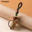 Bodhi Seed Blessing Keychain - carved Tathagata Buddha head in wooden frame with green jade and lotus beads on braided cord, wisdom