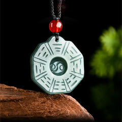 Natural Jade Bagua Yin Yang Pendant - Green jade bagua pendant with red bead on black cord, jade necklace