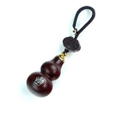 Red sandalwood gourd keychain with 8 guardians symbol on clean white background