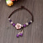 Amethyst Rose Quartz Crystal Charm Healing Anklet - Yin-Yang carved black stone bracelet on dark slate surface, flat lay p...