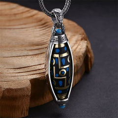 Nine-Eye Dzi Bead Pendant - Three-quarter view revealing gold geometric maze and blue stone accents