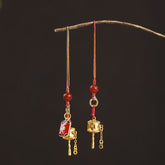 Prayer Wheel Phone Charm – Two charms hanging from wooden branch, Buddhist charm