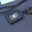 Ebony Wood Lotus Pendant – Three-quarter view on dark fabric, gold yantra, Spiritual