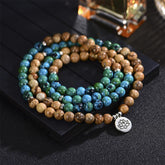 108 Meditation Healing Multilayer Mala – Three-tone stone bead coil with silver lotus charm on dark surface, meditation