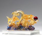 Handmade Dragon Liuli Crystal Art Piece - three-quarter view, amber dragon on blue waves, translucent