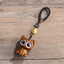 Green Sandalwood Key Chain – attached to phone, lucky cat koi fish charm in use