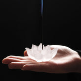 Lotus Liuli Incense Burner – cradled in palm with incense stick against dark backdrop, Serene