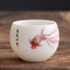 Koi Fish Porcelain Teacup - front view showing white ceramic cup with koi fish painting