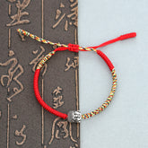 Handmade King Kong Knot Buddha Bracelet – Intricate diamond knot pattern in red cord with Buddha bead, protective wristwear