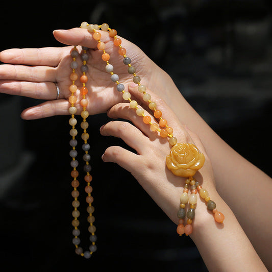 Golden Silk Jade Flower Pendant Necklace – ombre cream peach amber beads with carved rose pendant and tassel, hand-held display