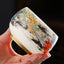 Dragon Playing Pearl Porcelain Teacup – Gold dragon with cobalt scales in ink-wash clouds, hand-held artisan craft